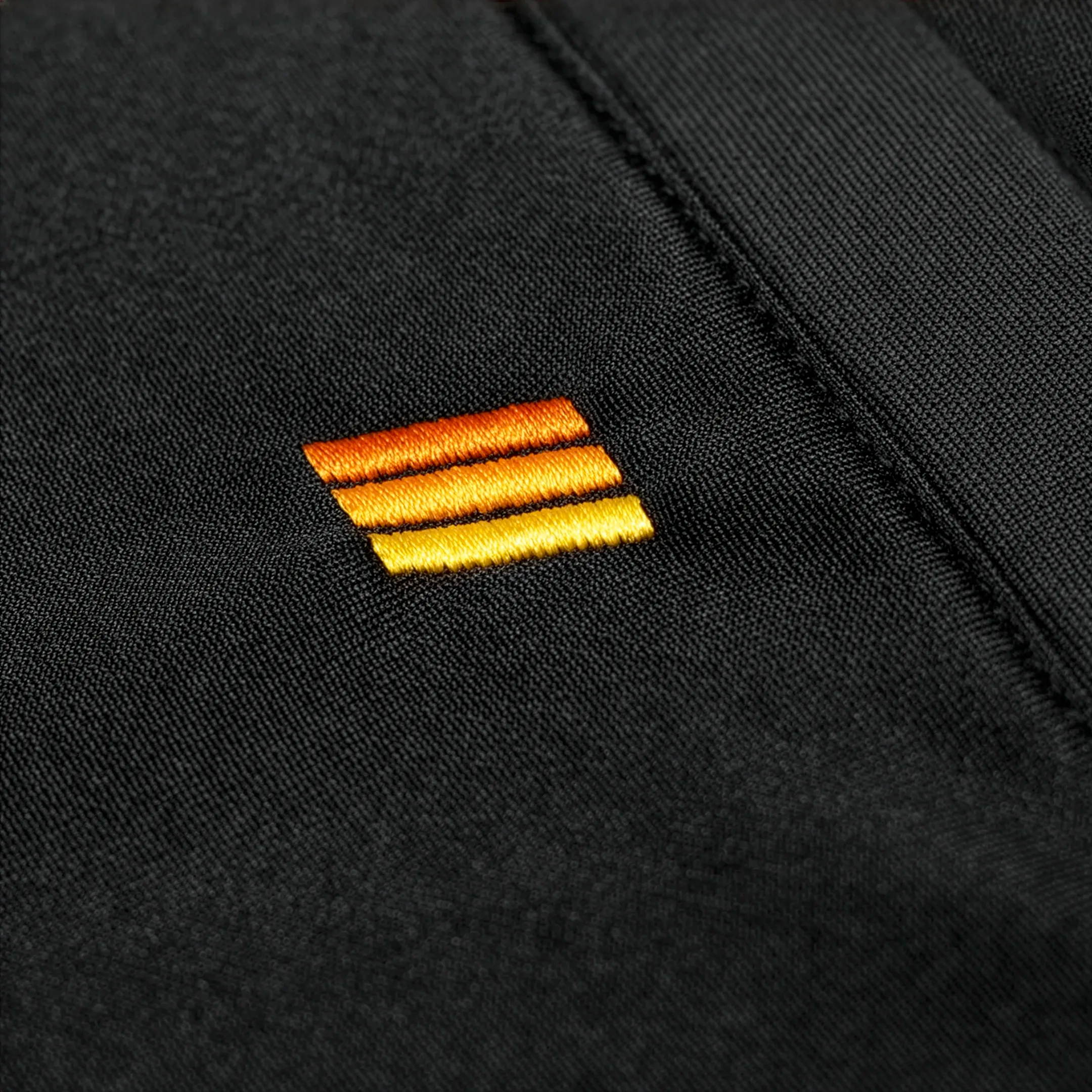 Black Jogger Pants Close Up on Embroidery